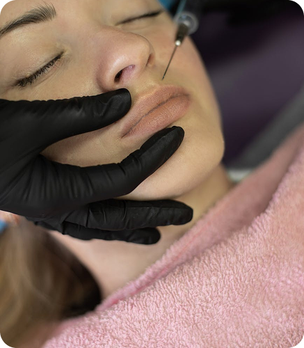 Woman receiving professional lip filler injection as part of aesthetic injectable treatments at Septre Clinicals.